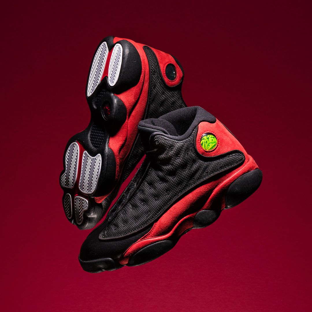 Jordan 13 Bred on red background