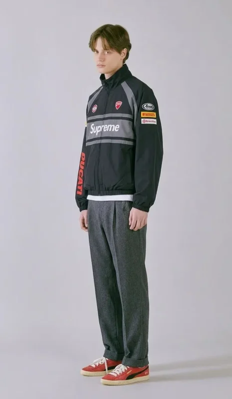 Modern street style blending Supreme streetwear with classic tailoring