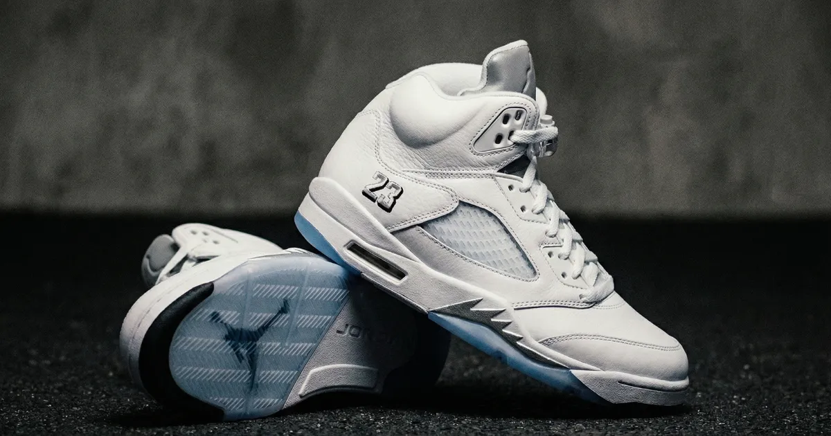 jordan 5 white metallic in front view with dark background